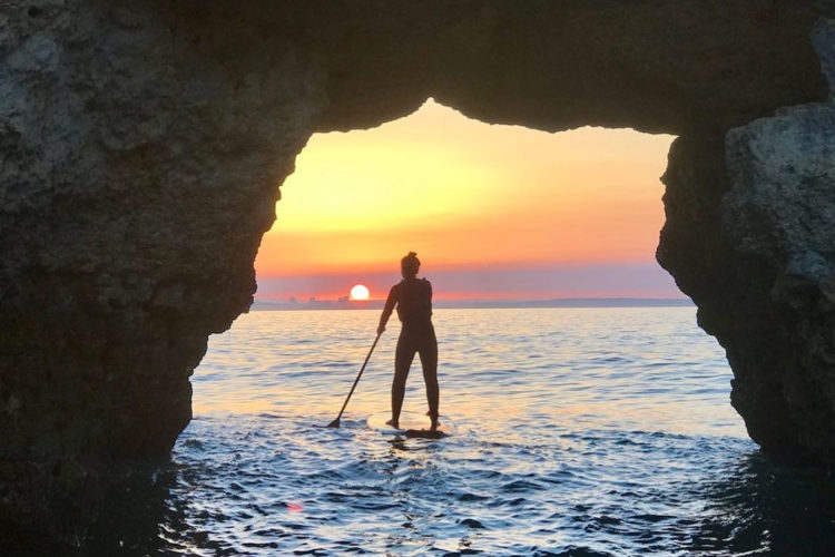 searching the grottos by SUP is the perfect way to experience sunset