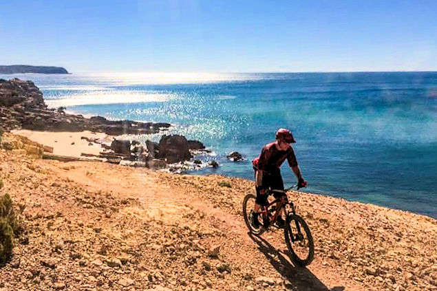The AltaVista Mountain Bike instructor cycling along the Algarve coast