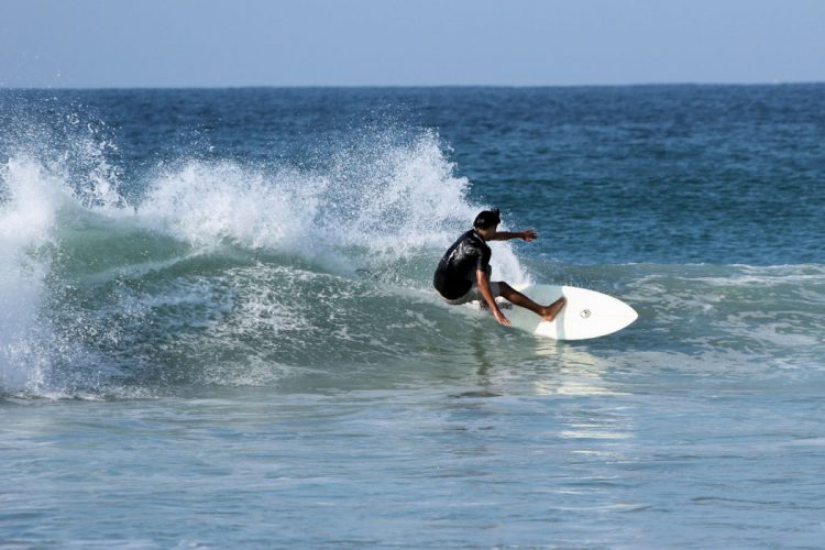 A surfer feeling the buzz of riding the waves on the AltaVista surf camp