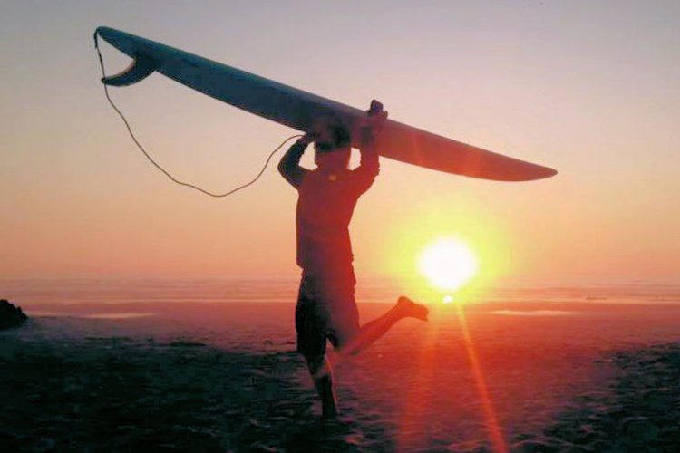 The excitement of surfing into the Algarve sunset