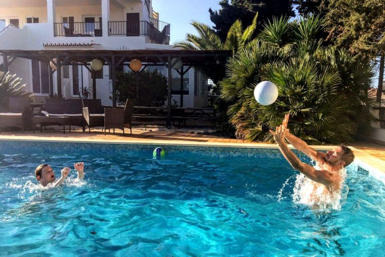 Guests enjoying the swimming pool at AltaVista Lodge