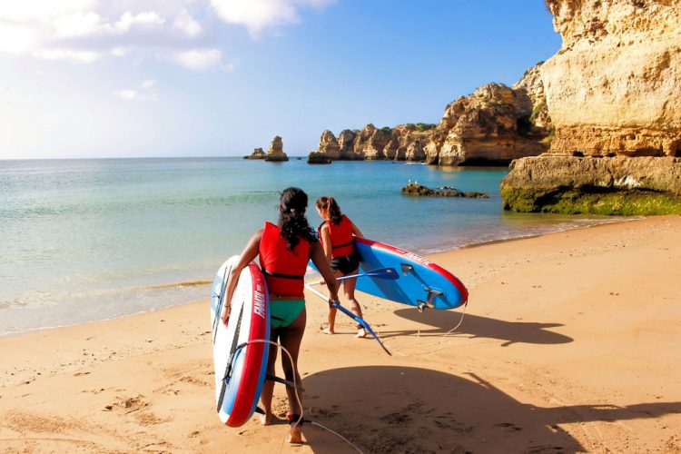 Two AltaVista guests beginning their Stand Up Paddleboard adventure