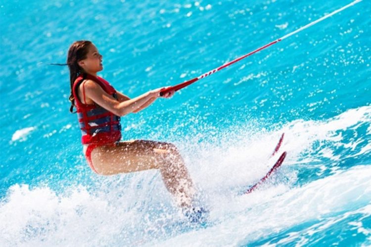 An AltaVista guest improving her waterski skills between Luz and Lagos